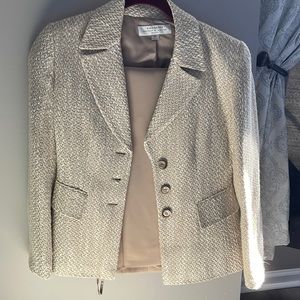 Women’s cream suit.  Dry cleaned only. Jacket and pants
